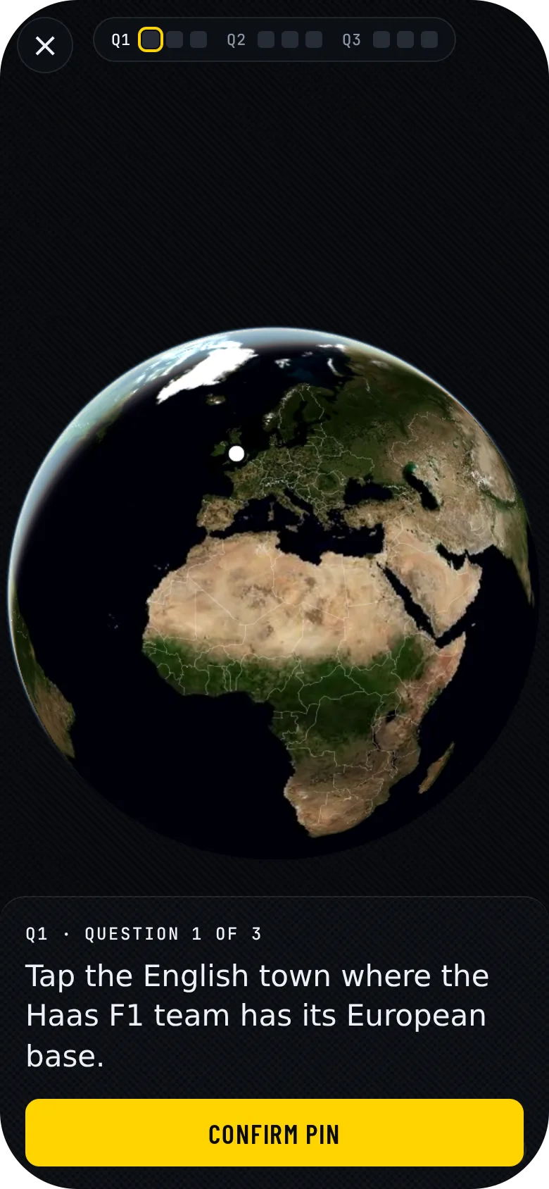 GeoGrandPrix on a phone: a satellite globe with a white pin dropped in England and an F1 clue card below